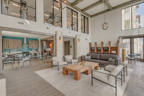 a living room with couches and chairs and a coffee table